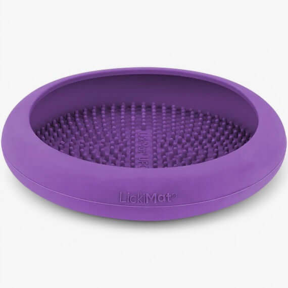 LickiMat UFO slow feeding bowl in purple, designed for dogs to promote relaxation and stress relief.