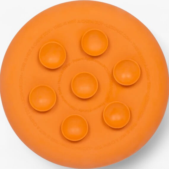 LickiMat UFO slow feeding bowl for dogs with suction cups and 3D texture design in vibrant orange color.