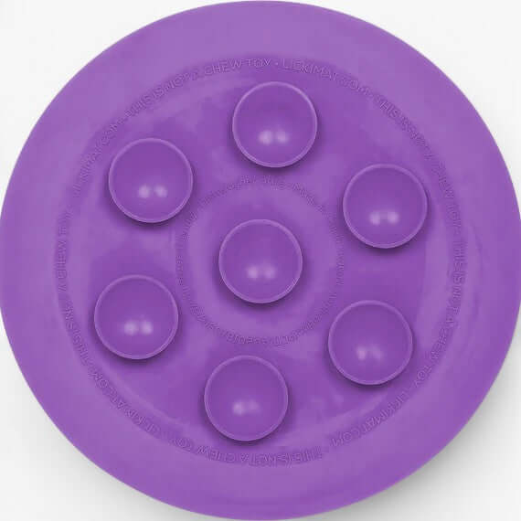 LickiMat UFO purple slow feeder bowl with suction cups for enriching pet mealtime.